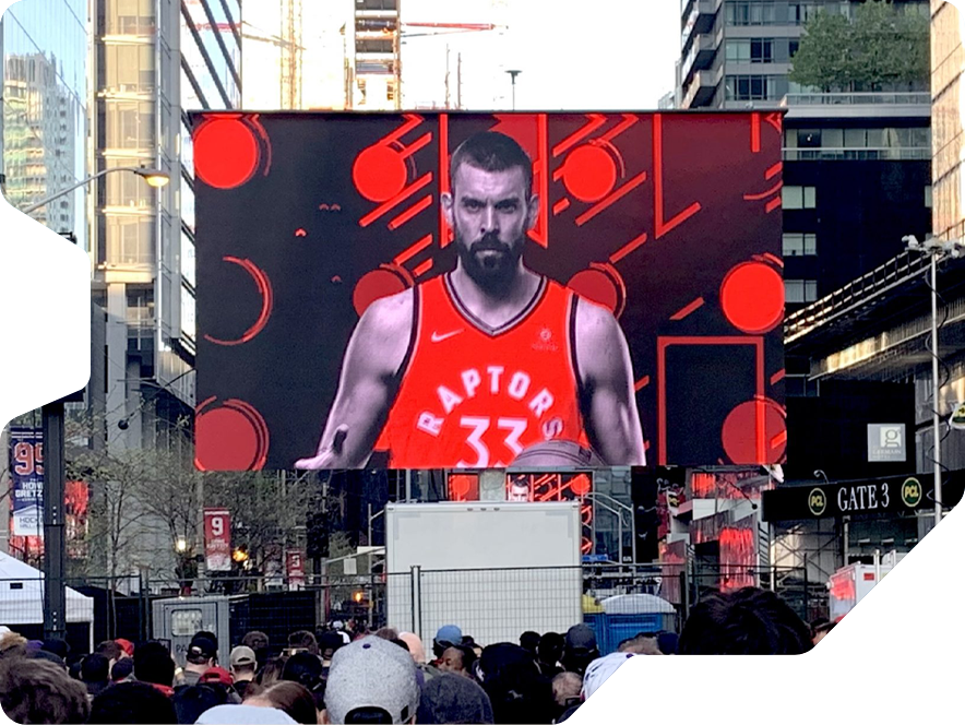 Closed led screen trailer by Creacar in use showing a Raptors game in the streets of Quebec Canada.