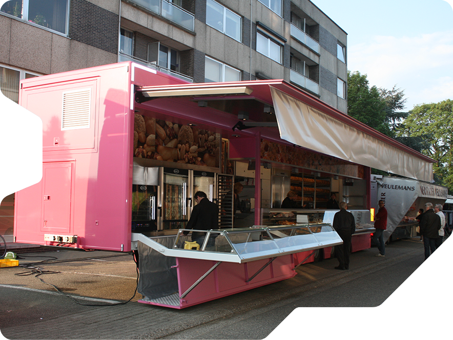 A custom extendable pink market trailer at the weekly market