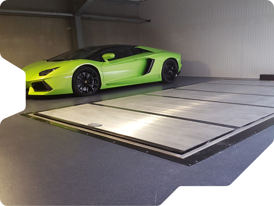 a closed car lift in the up position next to a lime green lamborghini car