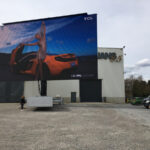 a rotatable mobile LED screen semi open trailer screen test at our manufacturing facility - woman and sports car on screen