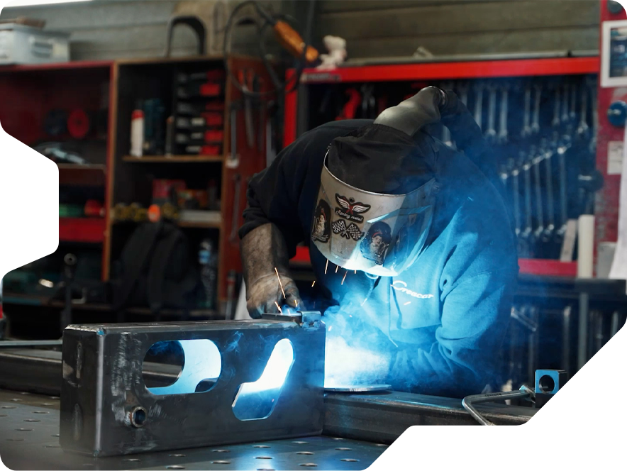 A welder at work at the Creacar construction site in Genk